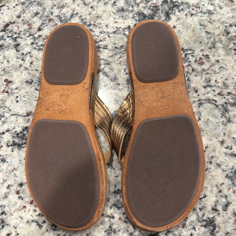 OluKai Women's Brown Leather Flip Flop Sandals with Metallic Bronze Straps - Picture 3 of 6